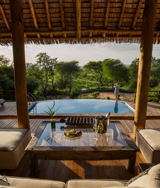 Tarangire_Treetops - accommodation - lounge overlooking swimming pool & waterhole (c) Silverless-7